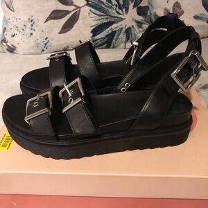 Black Leather Sandals with Buckle Detail.